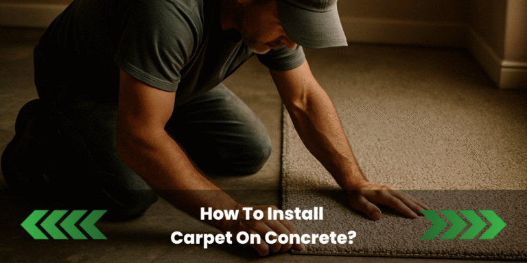 A photograph captures a handyman kneeling on a concrete floor, carefully installing a beige carpet. The scene is lit with warm indoor lighting, highlighting the textured surfaces of both the concrete and carpet. The man wears a grey T-shirt and cap, focusing intently as he aligns the carpet edge with precision.